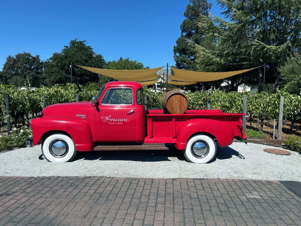 The vintage red truck at Bennesere vineyards, a preferred vendor of VinoBocce